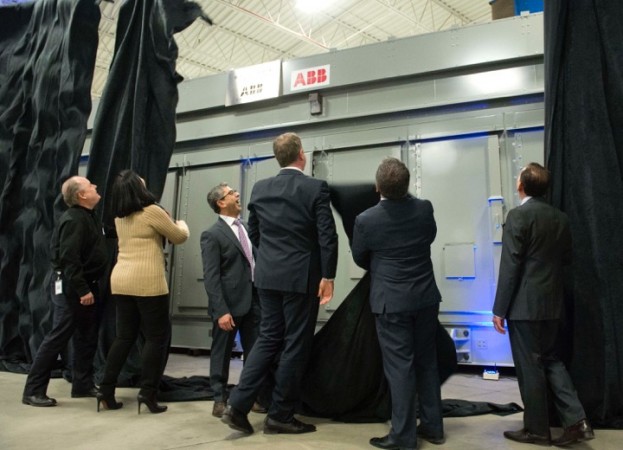 Fadi Emeid (centre, with glasses), president and CEO of Elias Custom Metal Fabrication Ltd.; Sam Emeid; City of Vaughan Mayor Maurizio Bevilacqua; MP Francesco Sorbera; Councillor Sandra Racco; and Steve Chomyc from ABB, unveil a 60,000 pound and 1,100 square foot E-house, the first ever to be manufactured in Ontario on March 4. Photo: Elias Custom Metal Fabrication Ltd. 